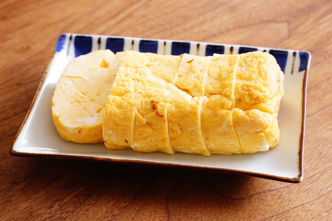 a dish of tamagoyaki, a japanese style omelette